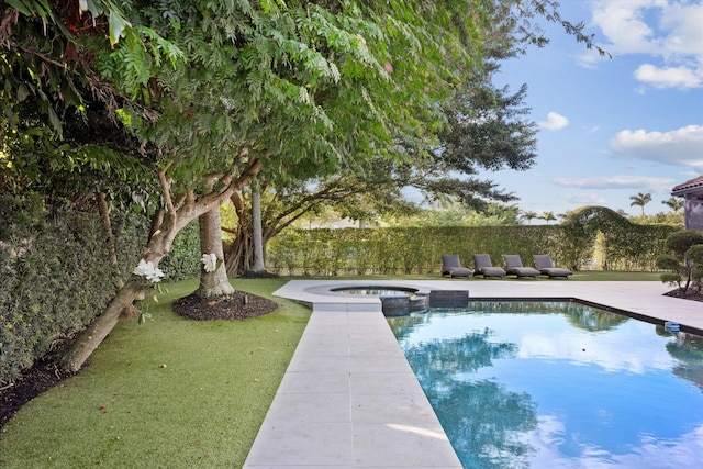 view of pool with a yard and an in ground hot tub