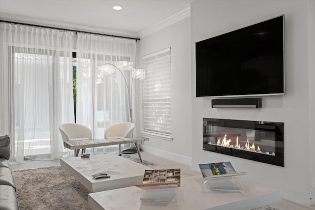 living room with crown molding and light hardwood / wood-style floors