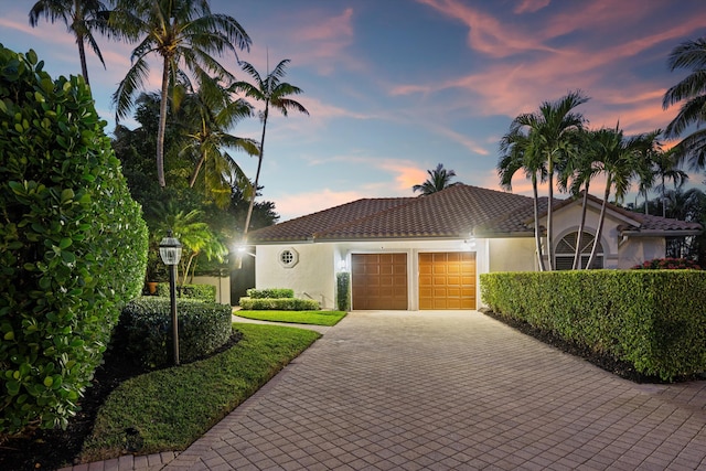 mediterranean / spanish-style house featuring a garage