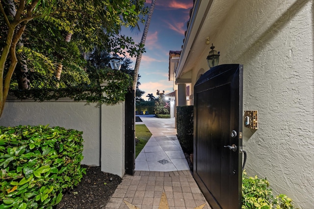 view of gate at dusk