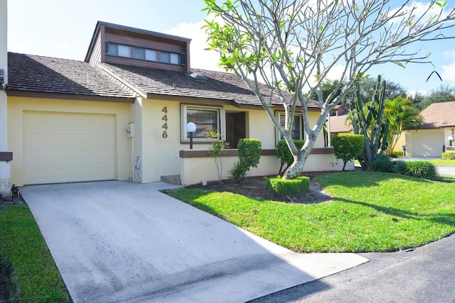 view of front facade with a front lawn and a garage