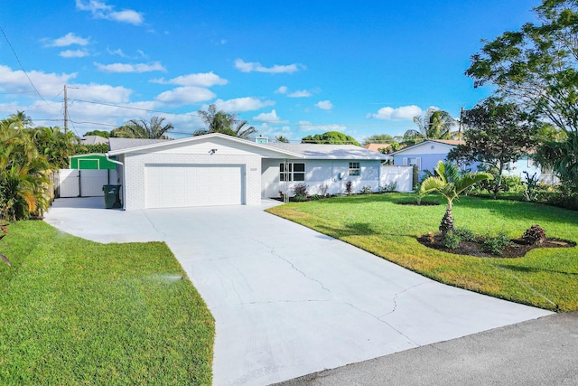 ranch-style house with a garage and a front yard