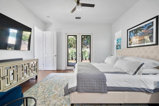 bedroom featuring french doors, access to outside, ceiling fan, and dark hardwood / wood-style floors