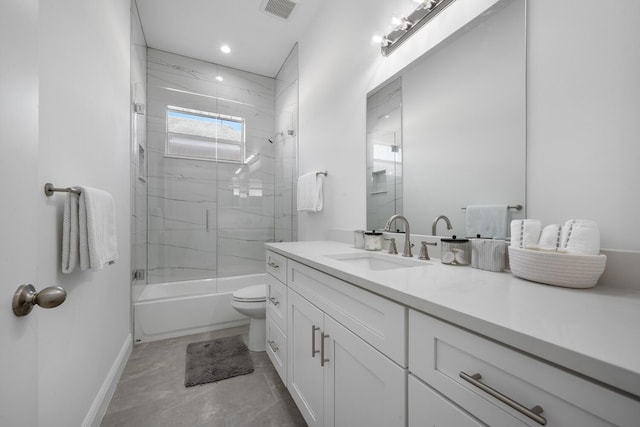 full bathroom with enclosed tub / shower combo, vanity, and toilet