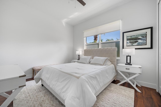 bedroom with dark wood-type flooring and ceiling fan