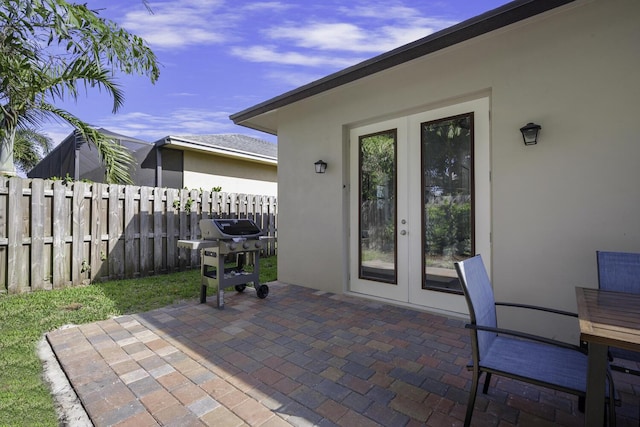 view of patio / terrace with area for grilling and french doors