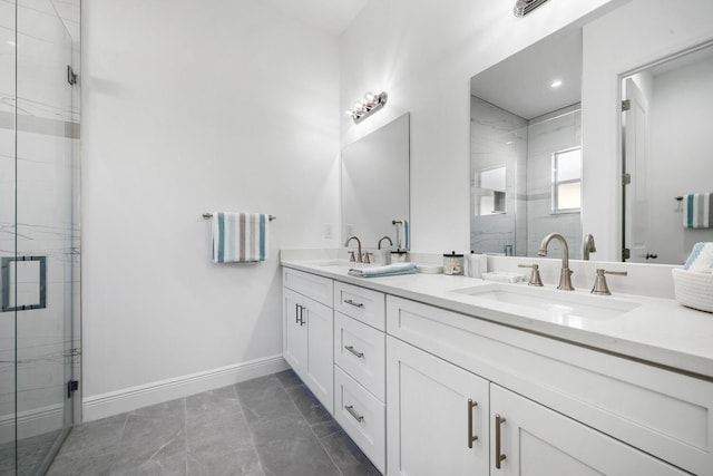 bathroom with tile patterned floors, vanity, and an enclosed shower