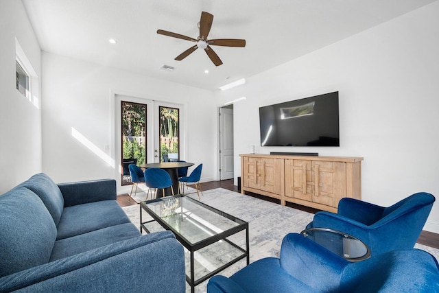 living room with hardwood / wood-style flooring and ceiling fan