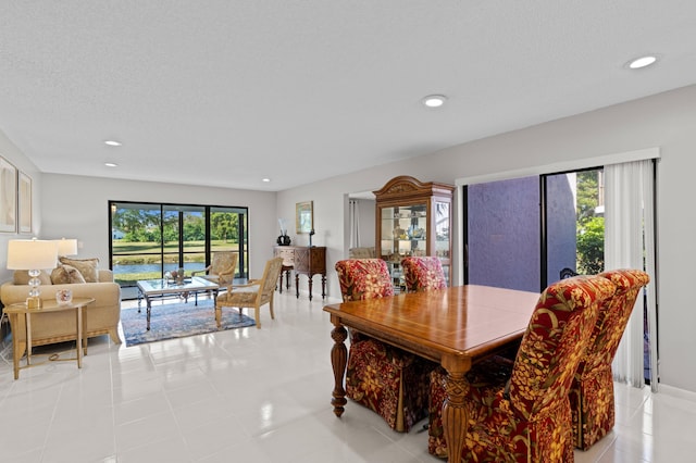 dining space with a textured ceiling