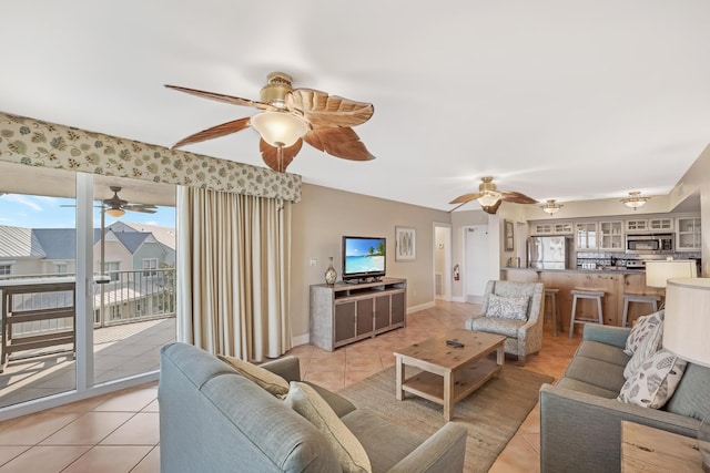 living room featuring ceiling fan and light tile patterned floors