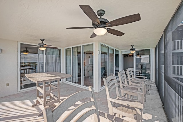 view of patio featuring ceiling fan