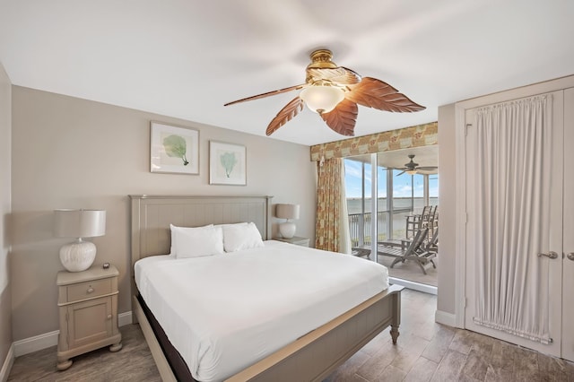 bedroom featuring ceiling fan, access to exterior, and hardwood / wood-style flooring