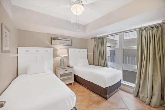 bedroom featuring ceiling fan and light tile patterned flooring