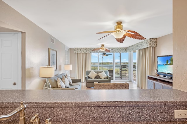 living room featuring ceiling fan