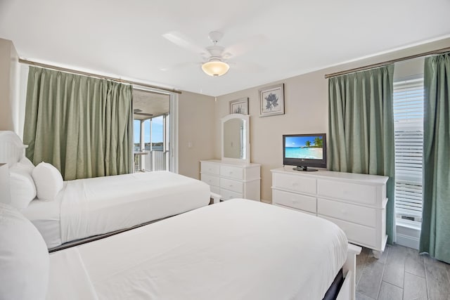 bedroom featuring ceiling fan and access to outside