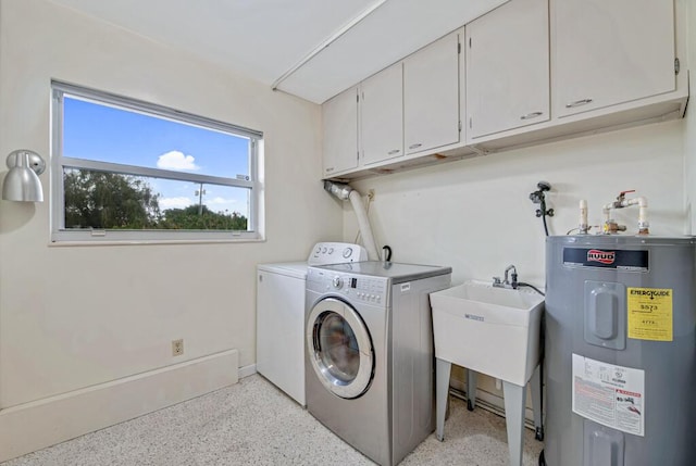 washroom featuring cabinets, independent washer and dryer, electric water heater, and sink