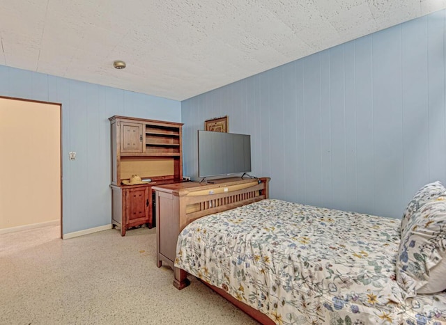 bedroom with wooden walls