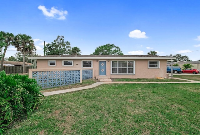 ranch-style home with a front yard