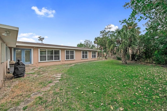 view of yard featuring french doors