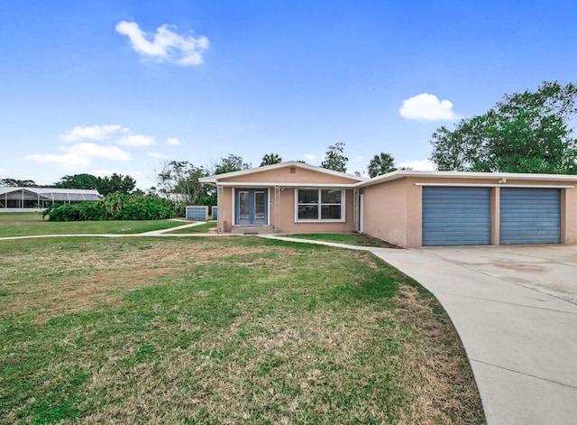 ranch-style home featuring a front yard and a garage