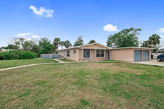 ranch-style home featuring a front yard and a garage