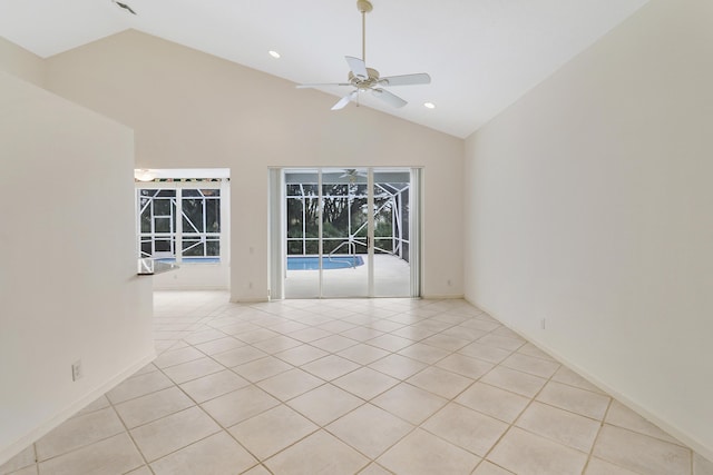 tiled empty room featuring ceiling fan and high vaulted ceiling