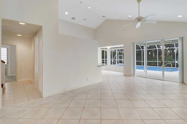 spare room featuring high vaulted ceiling, light tile patterned floors, and ceiling fan