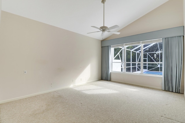 spare room with ceiling fan, lofted ceiling, and carpet