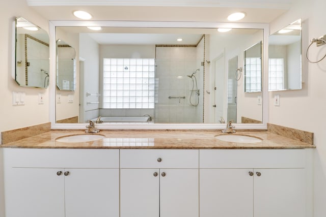 bathroom with plus walk in shower and vanity