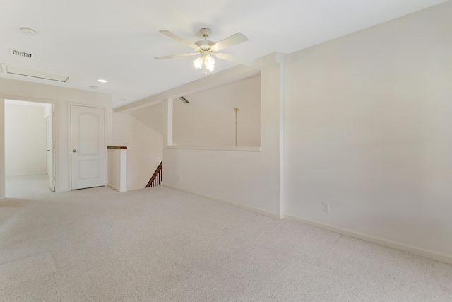 empty room featuring light carpet and ceiling fan