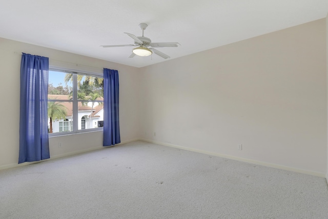 carpeted empty room with ceiling fan