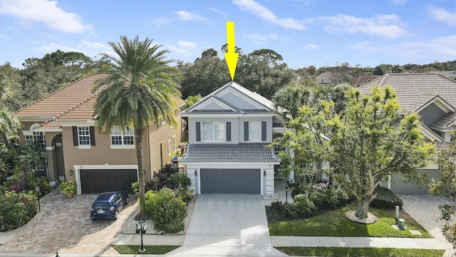 view of front of property with a garage