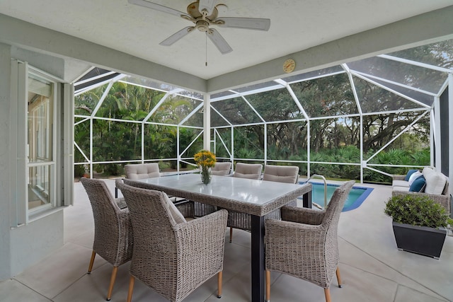 view of patio / terrace featuring ceiling fan and a lanai