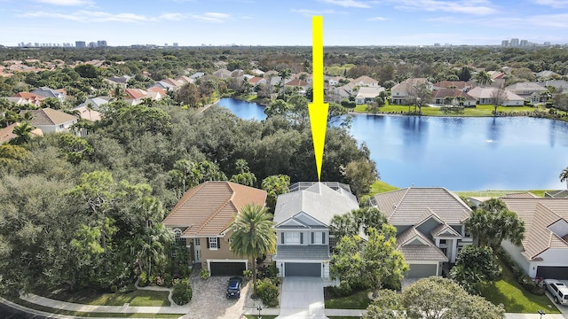 birds eye view of property featuring a water view