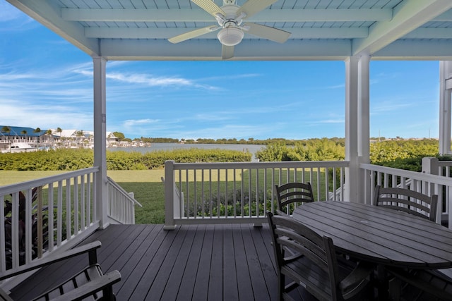 deck with a lawn and ceiling fan