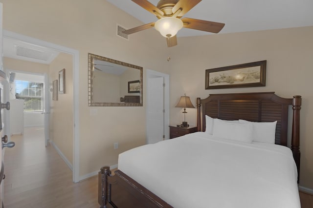 bedroom featuring ceiling fan and light hardwood / wood-style floors