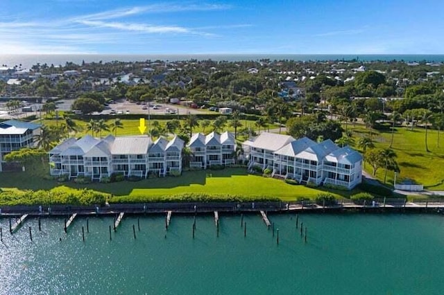 birds eye view of property featuring a water view