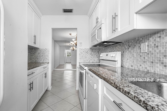 kitchen with light tile patterned floors, electric range oven, a notable chandelier, decorative backsplash, and white cabinets