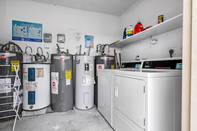 clothes washing area with washing machine and dryer, electric water heater, and gas water heater