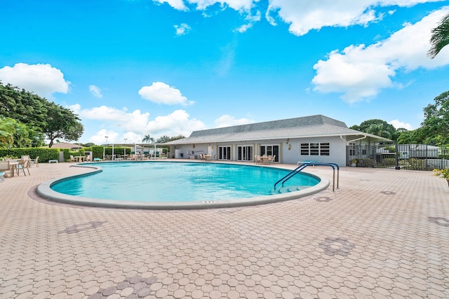 view of swimming pool with a patio area