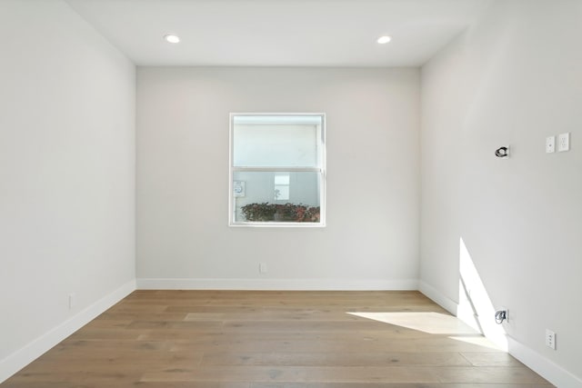 unfurnished room with light hardwood / wood-style flooring