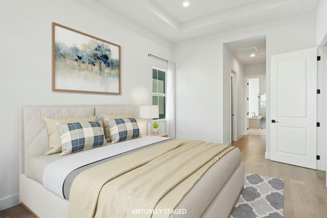 bedroom featuring hardwood / wood-style floors