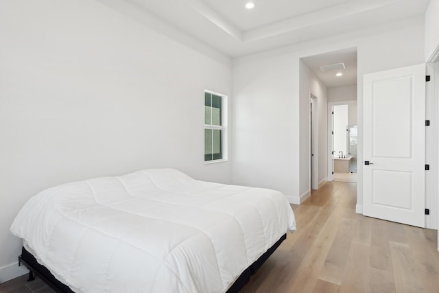 bedroom with light hardwood / wood-style flooring