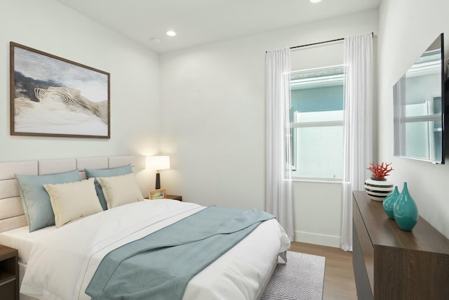 bedroom with light hardwood / wood-style flooring