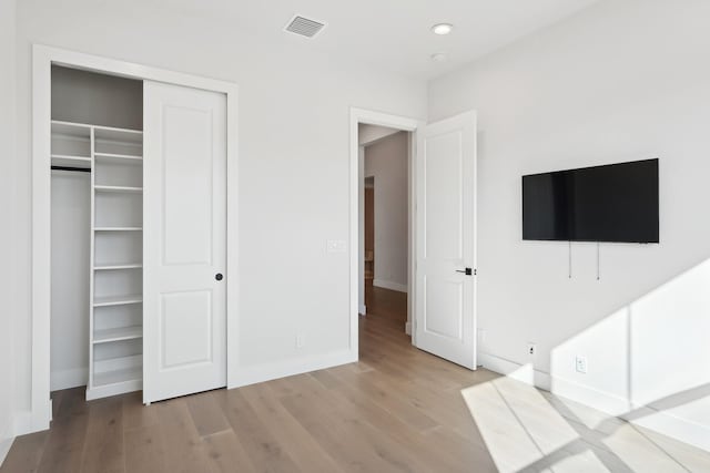 unfurnished bedroom featuring light hardwood / wood-style floors