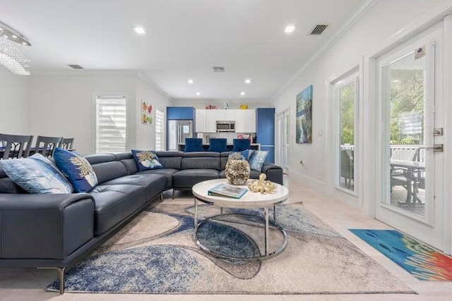 living room featuring crown molding