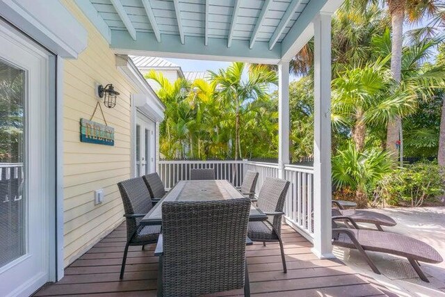 sunroom / solarium with beamed ceiling