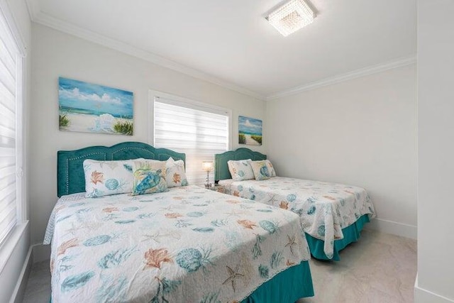 bedroom with multiple windows and crown molding