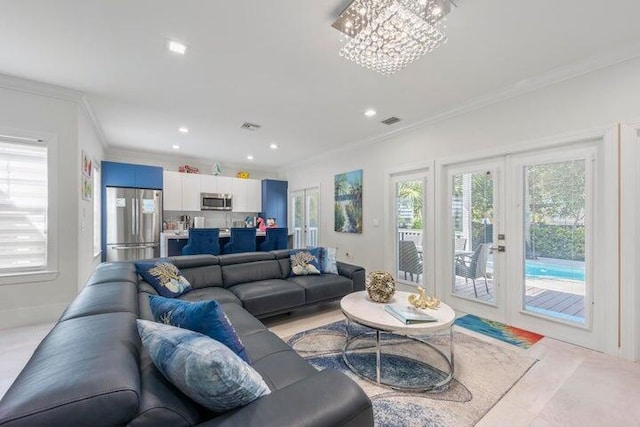 tiled living room featuring french doors, a notable chandelier, and ornamental molding