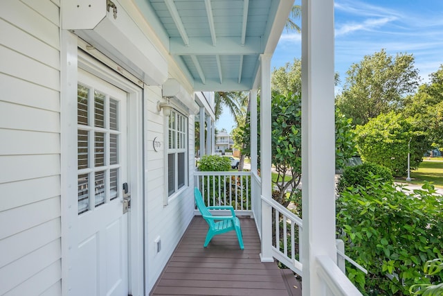 wooden terrace with a porch